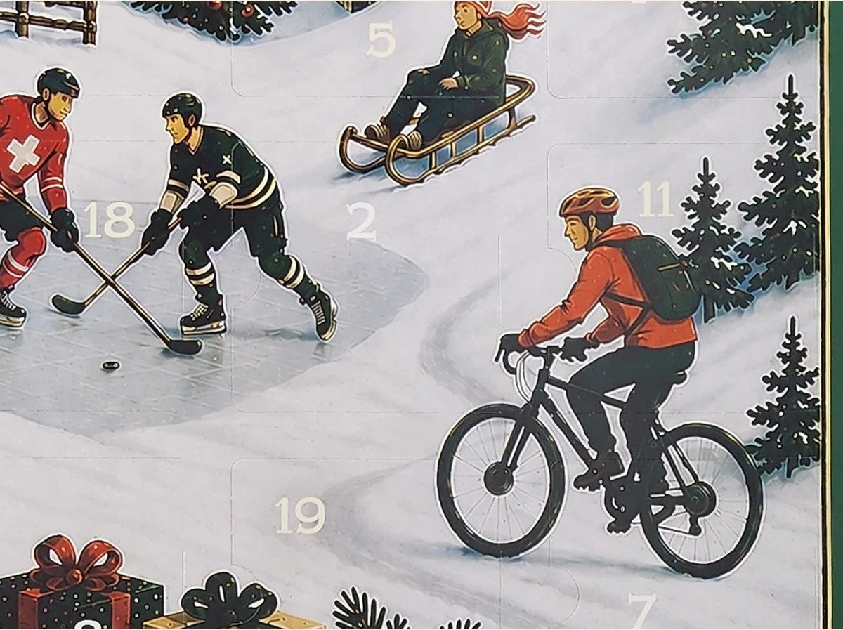 Gros plan du village enneigé et des sportifs illustrés sur le calendrier